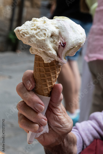 Closeup of melting Italian gelato ice cream cone