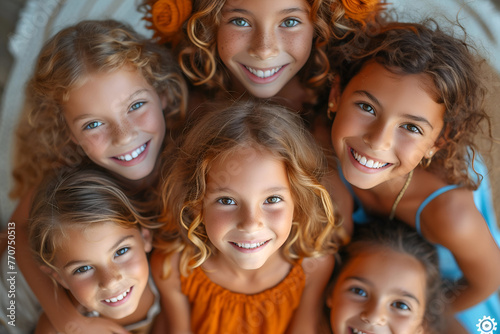 Group of happy children smiling, embracing and looking at camera. Copy space