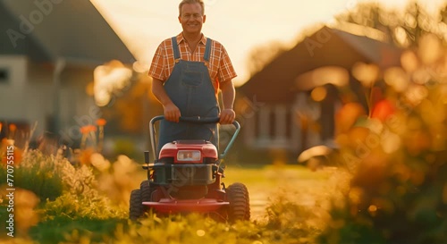 Full body photo of a happy middle aged man in overalls mowing the lawn with a modern lawnmower, with short hair photo