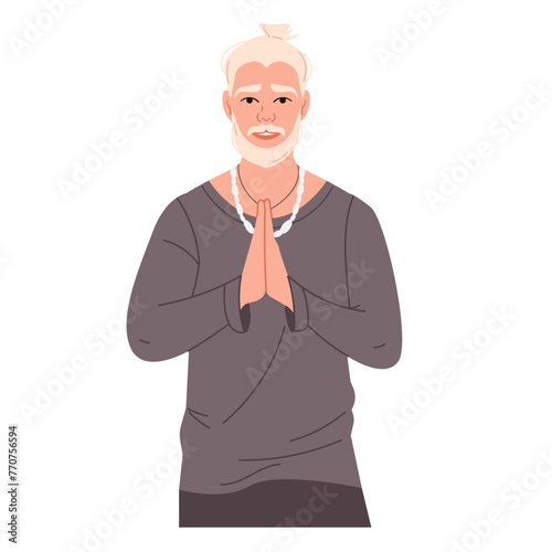 A young blonde yogi with tied hair, mustache and beard with a Namaste gesture