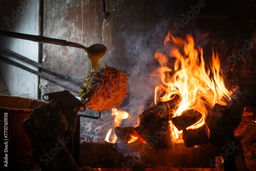 Wood-fired spit-roasted cake, Pyrenees-Atlantique, France. High quality photo