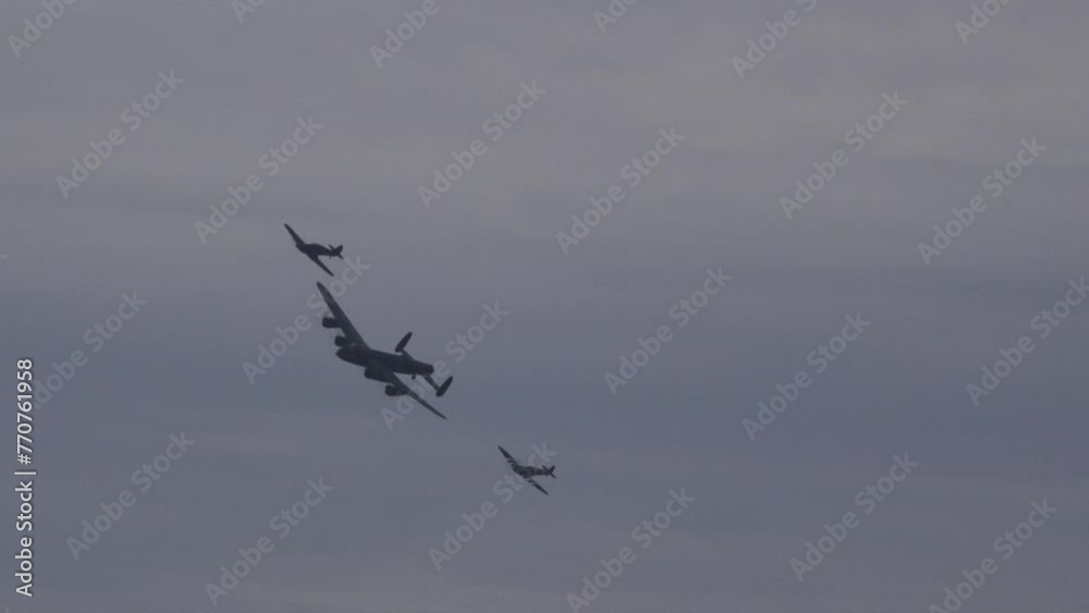 Avro Lancaster bomber world war 2 plane spitfire and Hawker Hunter in formation in the sky. Flying close to camera England UK 4K Avro Lancaster bomber world war 2 plane spitfire and Hawker Hunter in formation in the sky. Flying close to camera England UK 4K