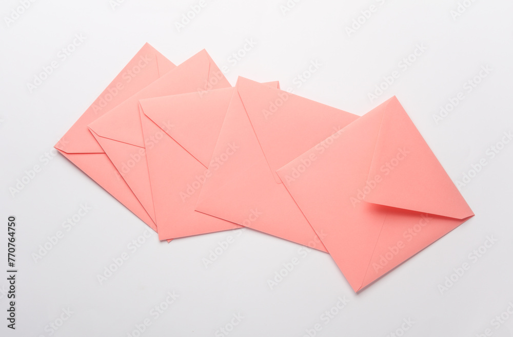 Pink square paper envelopes on white background Pink square paper envelopes on white background