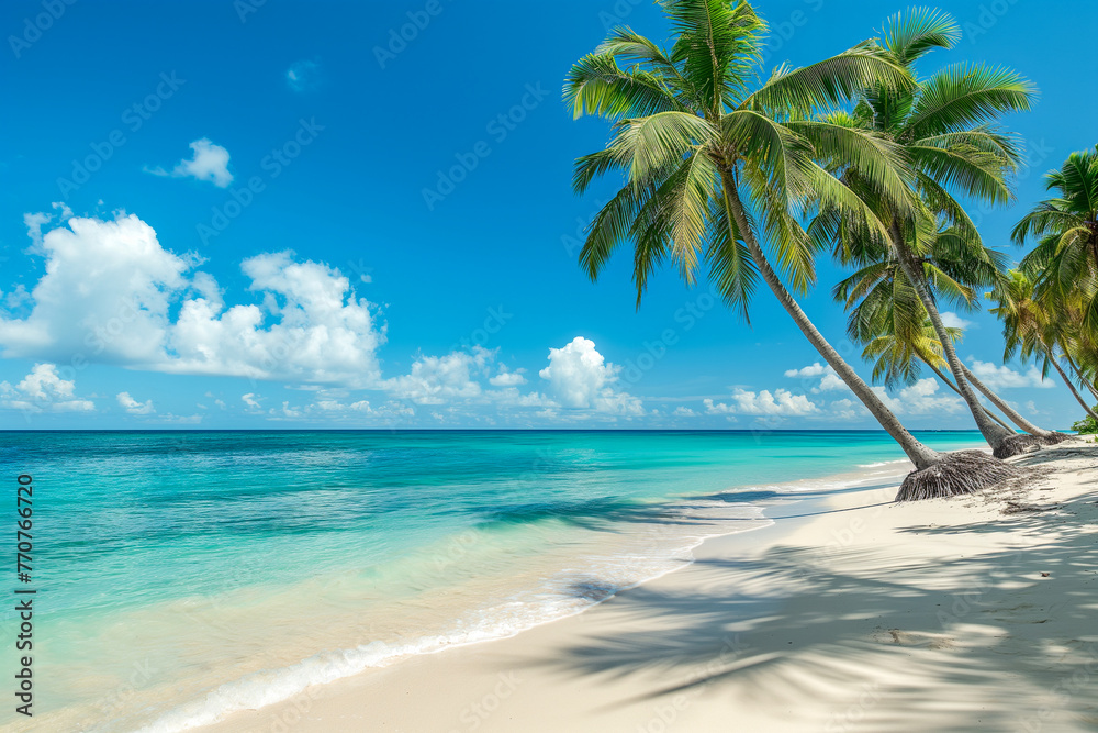 Pristine sandy beach with swaying palm trees and the calm blue ocean under a clear sky, epitomizing a peaceful tropical escape.