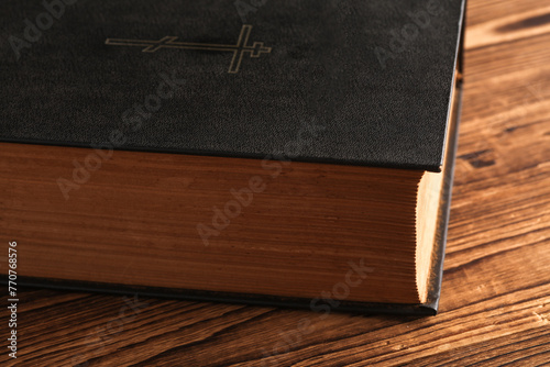 Close up of bible book on wooden table
