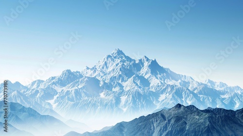 A majestic mountain range under a clear blue sky with space for text symbolizing adventure and exploration © Sara_P