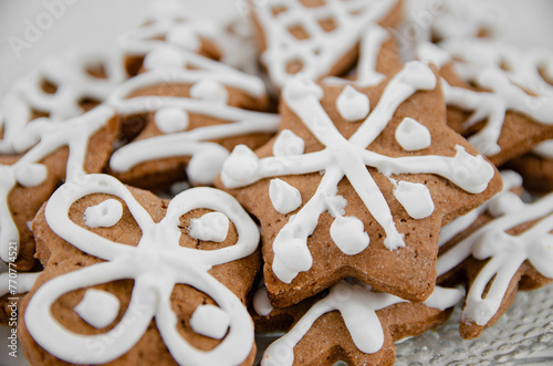 brown fresh gingerbreads with white decorative icing in various shapes