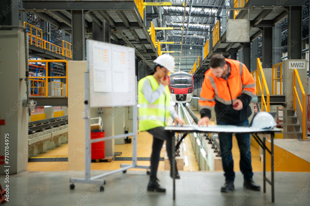 custom made wallpaper toronto digitalMale and female engineers work together in an electric repair station, Check the details of the electric train repair schedule.