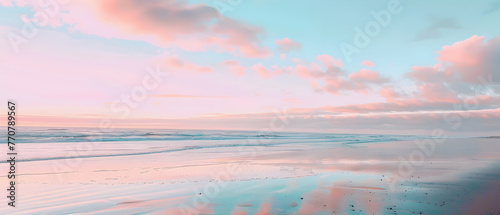 Captivating image of a beach with pastel pink and blue skies reflecting on the wet sand