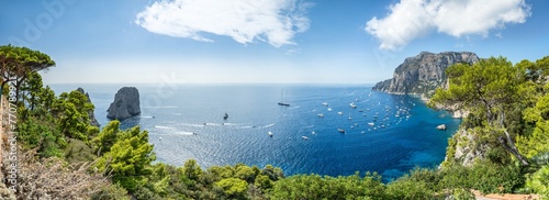 Capri island in summer seen from Belvedere di Tragara, Gulf of Naples, Campania, Italy photo