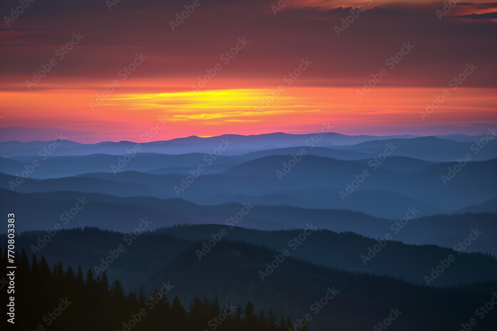 Sunset Spectrum: Layered Mountain Silhouettes Against a Hazy Backdrop of Red, Purple, Blue, Yellow, and Orange