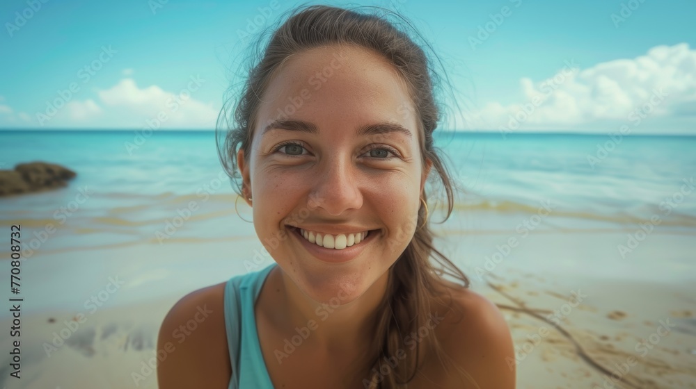 closeup shot of a good looking female tourist. Enjoy free time outdoors near the sea on the beach. Looking at the camera while relaxing on a clear day Poses for travel selfies smiling happy tropical