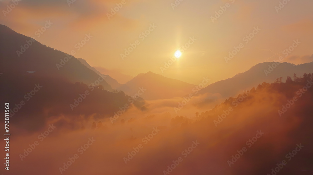 Obraz premium Sunrise Over Misty Mountain Valleys - peaceful nature - The sun rises, casting a golden glow over the mist-enshrouded valleys nestled between the mountain peaks.