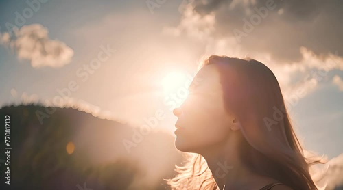 Girl hair flutters in wind, they believe in goodness, women dream of love. Portrait of girl, sun day, silhouette. Beautiful flowing female brown hair. Young woman looks at skym photo