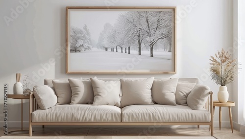 A large portrait picture frame with a white wooden frame hangs on the wall of an empty living room