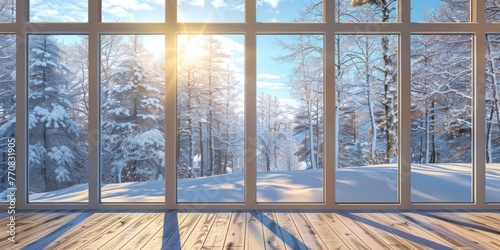 A large window with an open view of snow-covered trees and a clear sky  creating a serene winter landscape