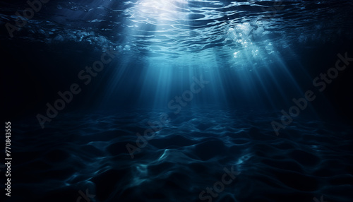 Deep blue underwater scene with rays of light © Brittany