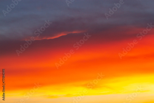 Fototapeta Naklejka Na Ścianę i Meble -  Fiery Orange Clouds At Sunset.