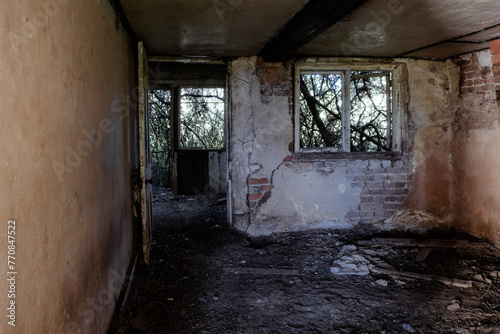 Inside a spooky eerie ruined abandoned house. With broken windows and doors in the countryside