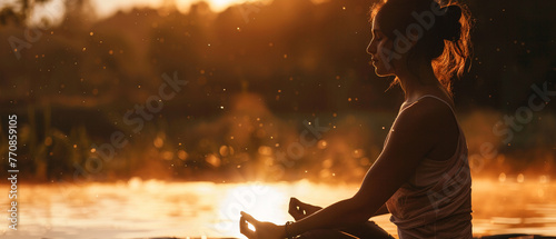 A woman meditation in hobbies provides a healthy outlet for stress. Silhouette of worship painted a serene scene against the setting sun.