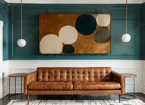 A minimalist living room with teal walls, white wainscoting and an elegant leather sofa