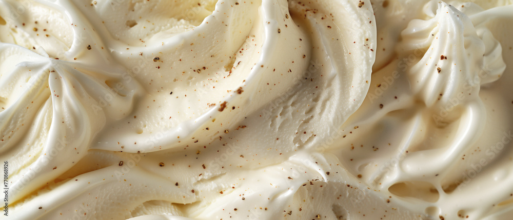 A closeup of the texture and swirls in Vanilla ice cream with Chocolate chip topping A closeup of the texture and swirls in Vanilla ice cream with Chocolate chip topping