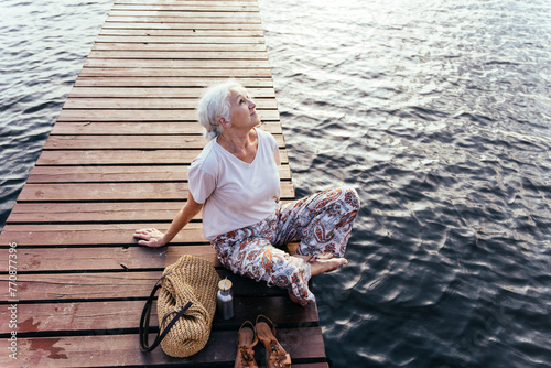Senior aged woman feeling freedom,enjoying vacation. No stress,calm mind,relax, happy retirement, healthy lifestyle, outdoor portrait.