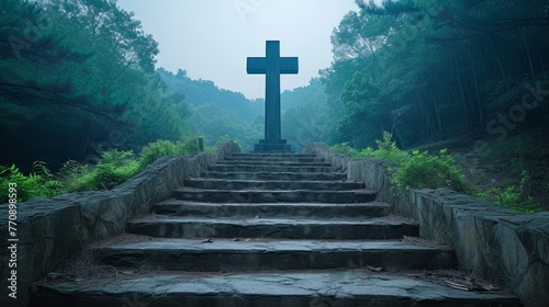   A cross atop forest steps, beside a stony wall in the heart of the woods photo