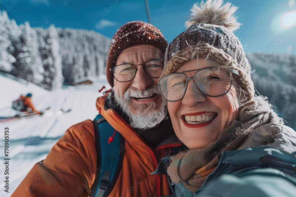 Selfie portrait of senior active smiling mature couple sledding skiing in glasses look happy on top of mountains Selfie portrait of senior active smiling mature couple sledding skiing in glasses look happy on top of mountains
