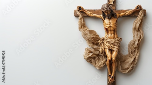  A crucifix, adorned with a cloth, and a statue of Jesus on the cross hung on the wall