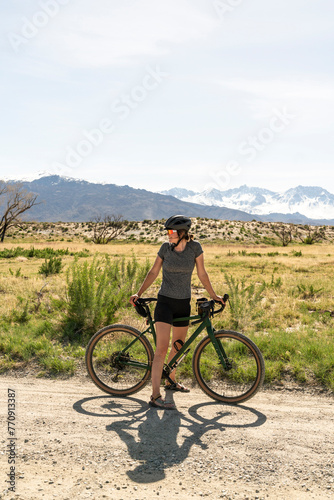 Woman standing with bike outside