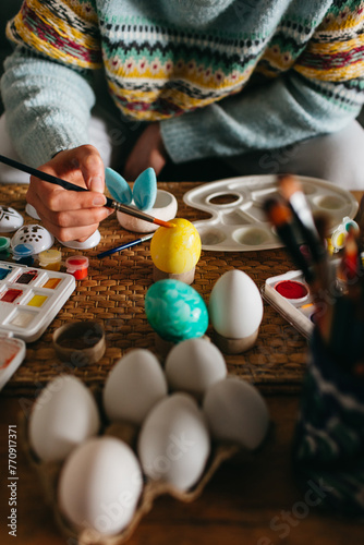 A woman doing crafts for Easter photo