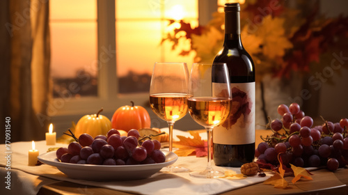 Cozy autumn setting with wine  two glasses  grapes  and pumpkins on a table  a warm sunset visible through the window