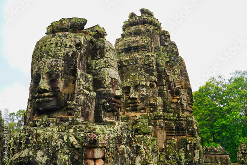 Bayon Temple - Masterpiece of Khmer Architecture built as a Buddhist temple by Jayavarman VII with over 200 towering smiling and serene looking Buddha faces at Siem Reap, Cambodia, Asia photo