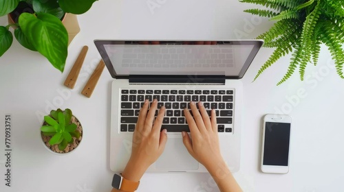 Person Typing on Laptop at Table