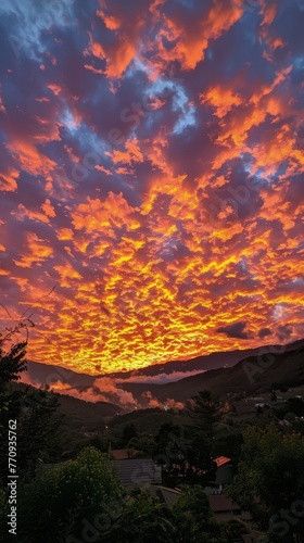 Sun Setting Over Distant Mountains