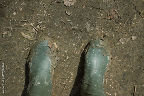 Wallpaper Mural Rubber boots dirty with mud. Concept of adventure and tourism. Torontodigital.ca