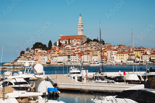 Historic cityscape of Croatian Mediterranean sea coast - old town Rovinj Croatia and boats on water of Istria Croatia