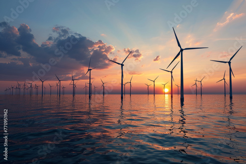 Offshore wind turbines generating energy at sunrise