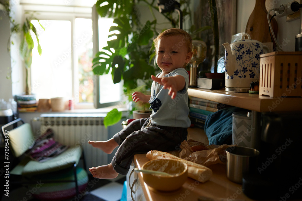 Portrait of a nervous little boy on the counter
Portrait of a nervous little boy on the counter