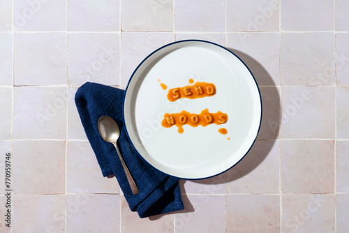 Alphabet pasta on plate spelling out funny message. photo
