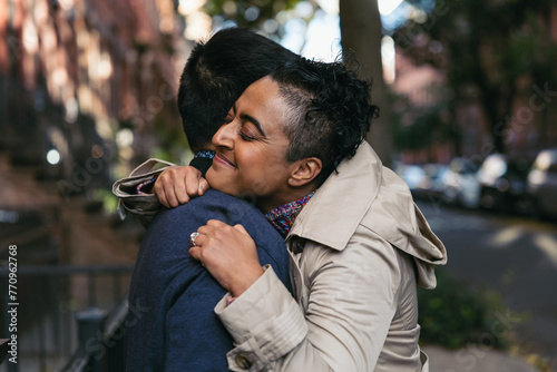 Loving Couple Hugging In City photo