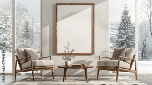 Photo mockup of an interior design scene with two armchairs, a coffee table and a wooden frame on the wall in front of it © Chand Abdurrafy