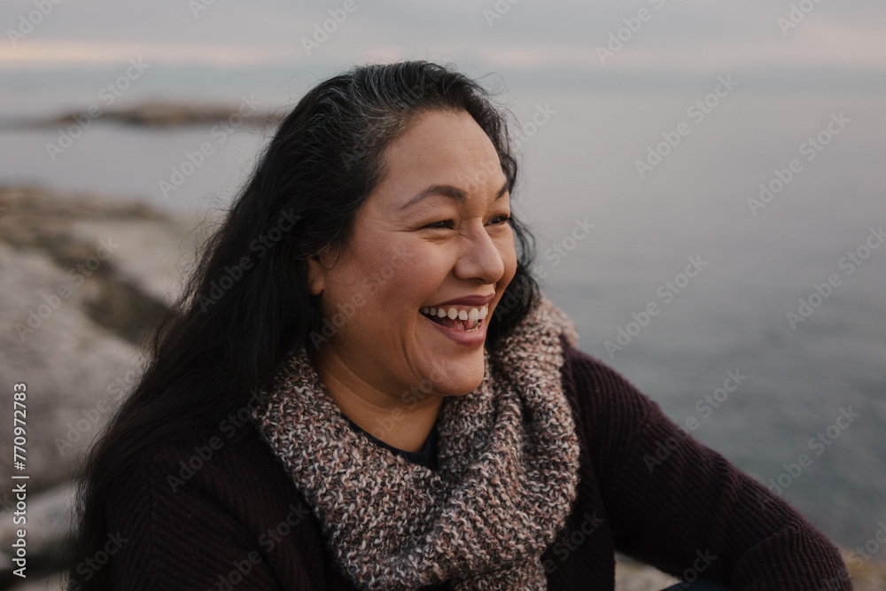 Women sitting outside and smiling. Women sitting outside and smiling.