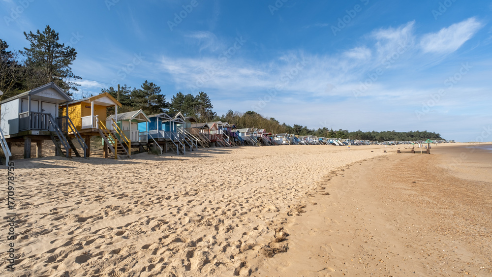 Traditional wooden beach huts on the sand in Wells on the North Norfolk coast Traditional wooden beach huts on the sand in Wells on the North Norfolk coast