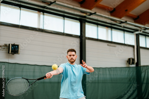 A man plays tennis