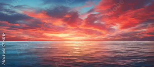 A stunning natural landscape painting depicting a sunset over the ocean with orange and red hues reflecting off the water  under a sky filled with clouds and an afterglow