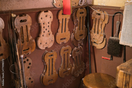 Detail of the multiple templates for making violins in the workshop of the master luthier, wood craftsman