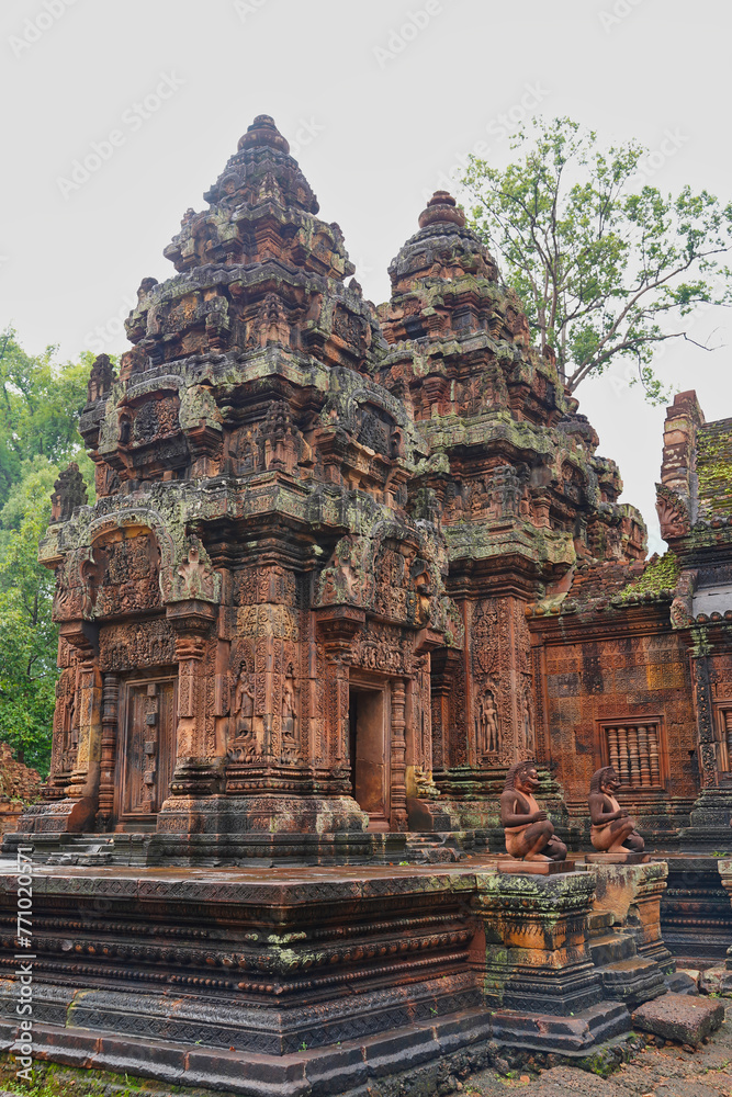 Naklejka premium Banteay Srei - 10th century Hindu temple and masterpiece of old Khmer architecture built by Yajnavaraha in red sandstone at Siem Reap, Cambodia, Asia