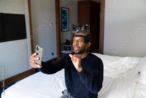 Man On Video Call In The Hotel After Hair Transplantation photo